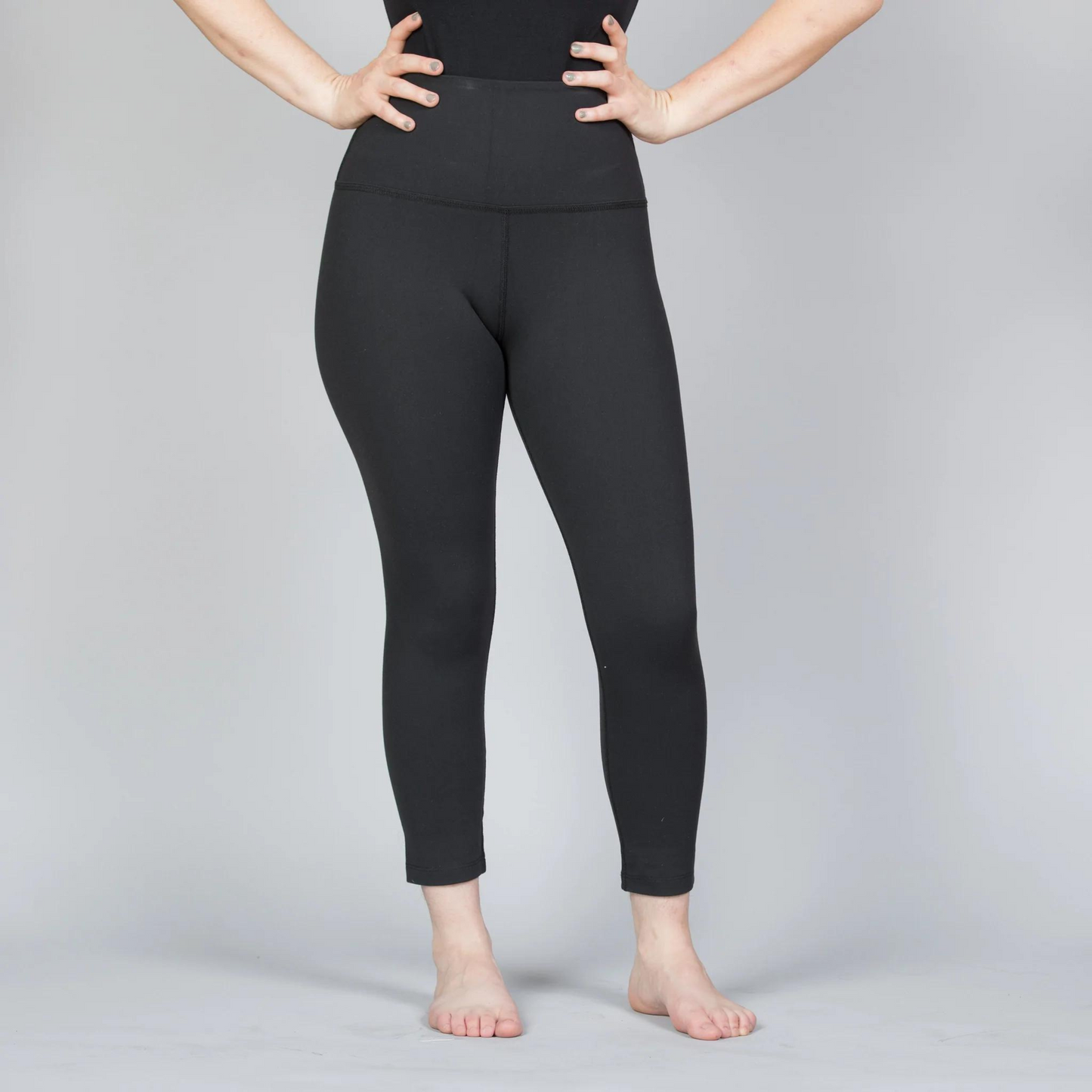 front of black high waisted carpi leggings