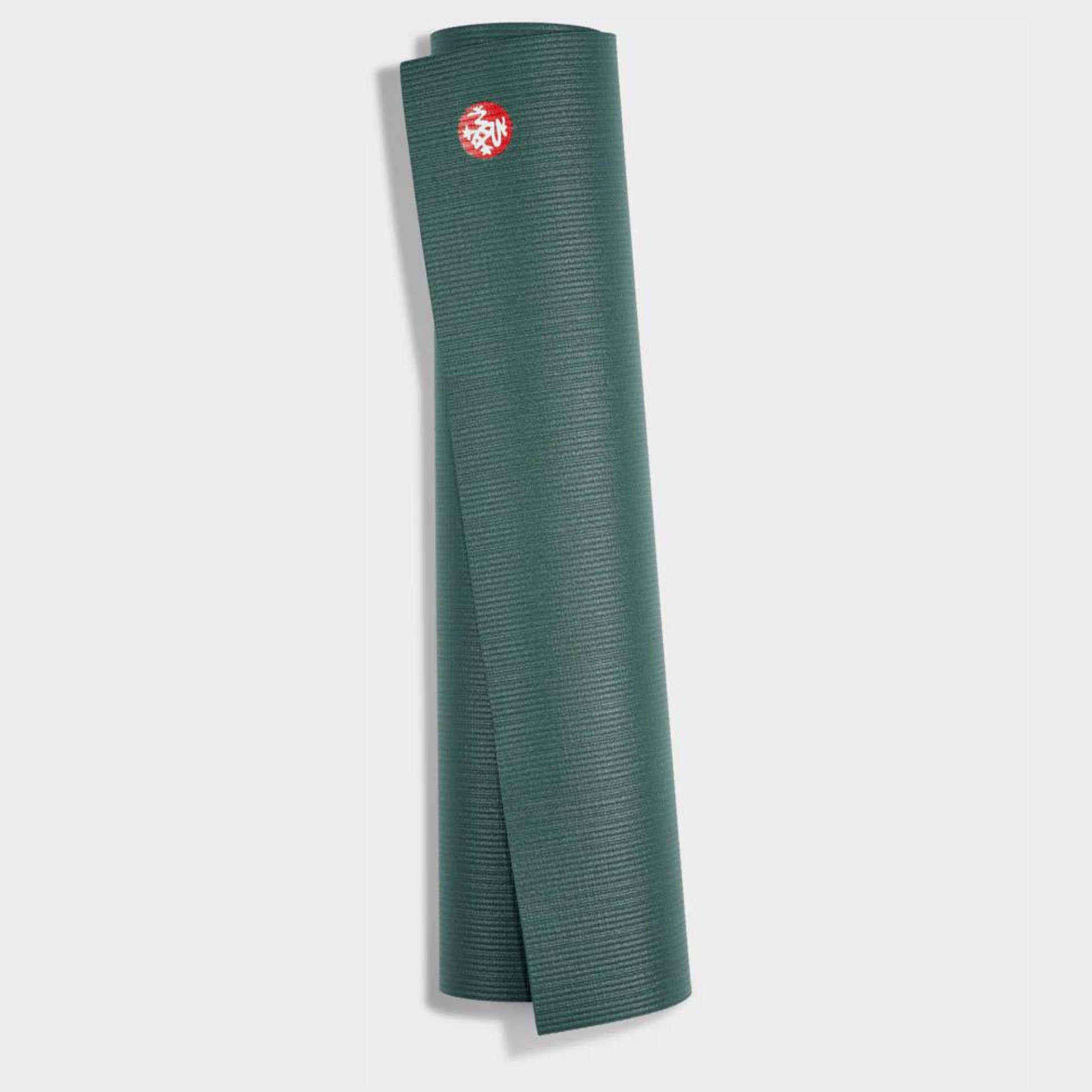 manduka pro yoga mat rolled up in black sage color