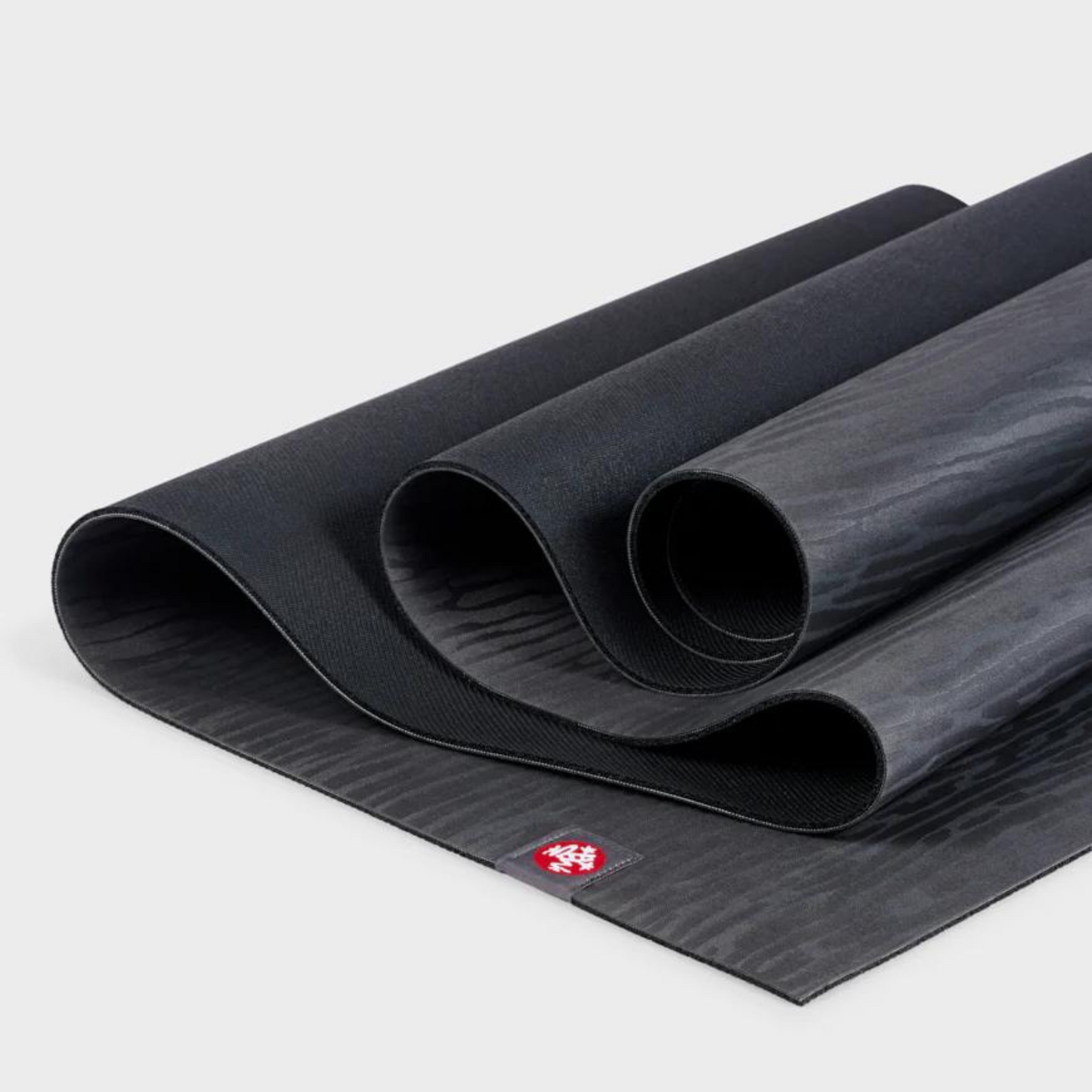dark charcoal manduka eko lite yoga mat folded over