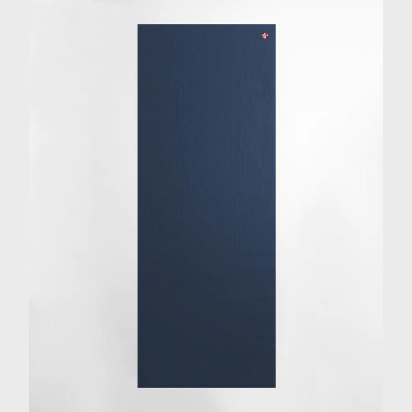 dark navy manduka pro lite yoga mat rolled flat