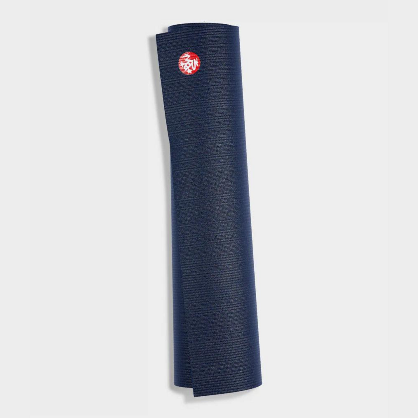 dark navy manduka pro lite yoga mat rolled up