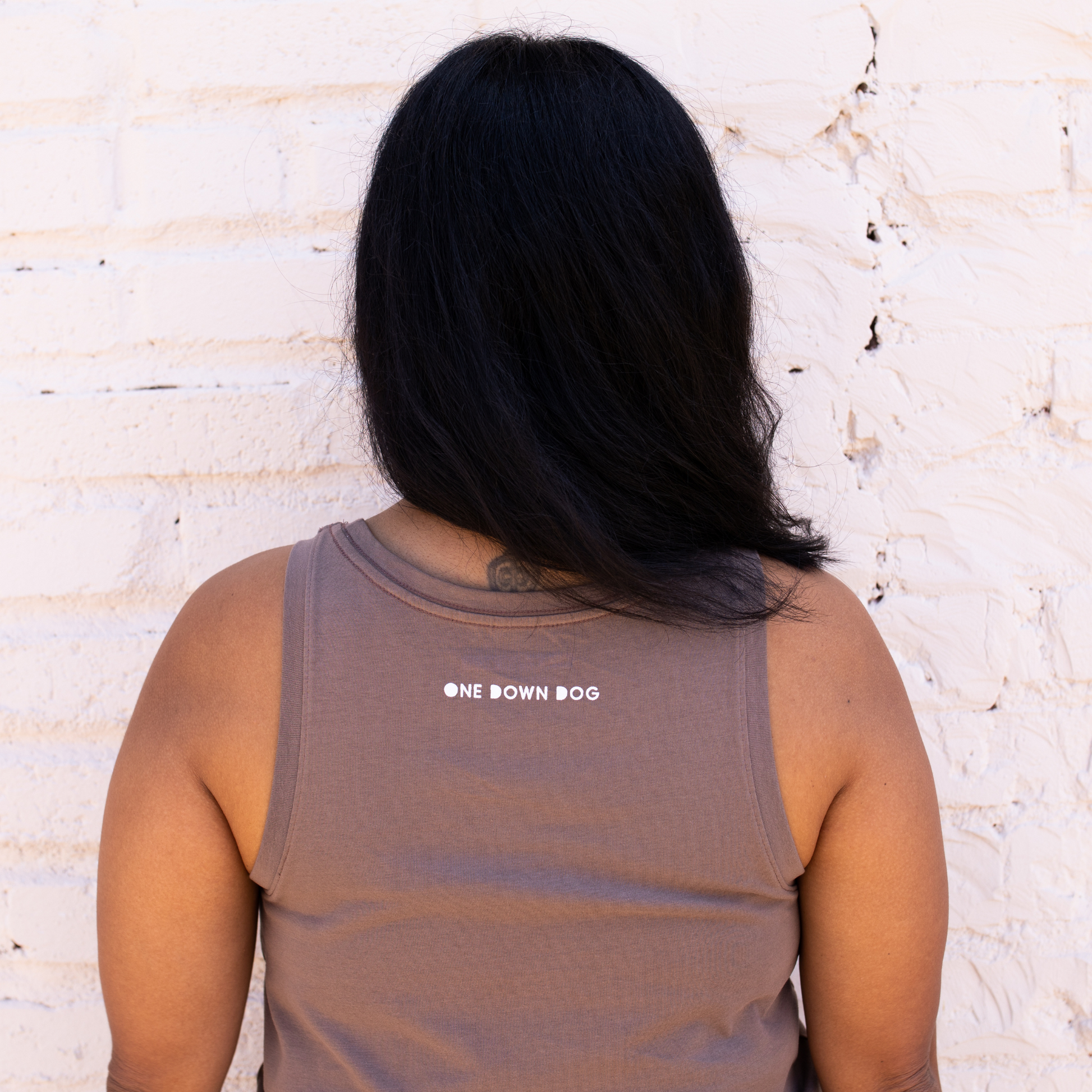  back of cropped tank with phrase one down dog
