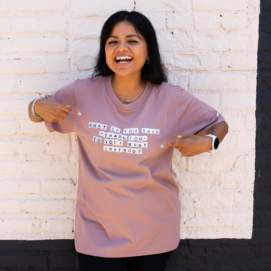 woman wearing unisex tee with the words what if you said thank you to your body instead