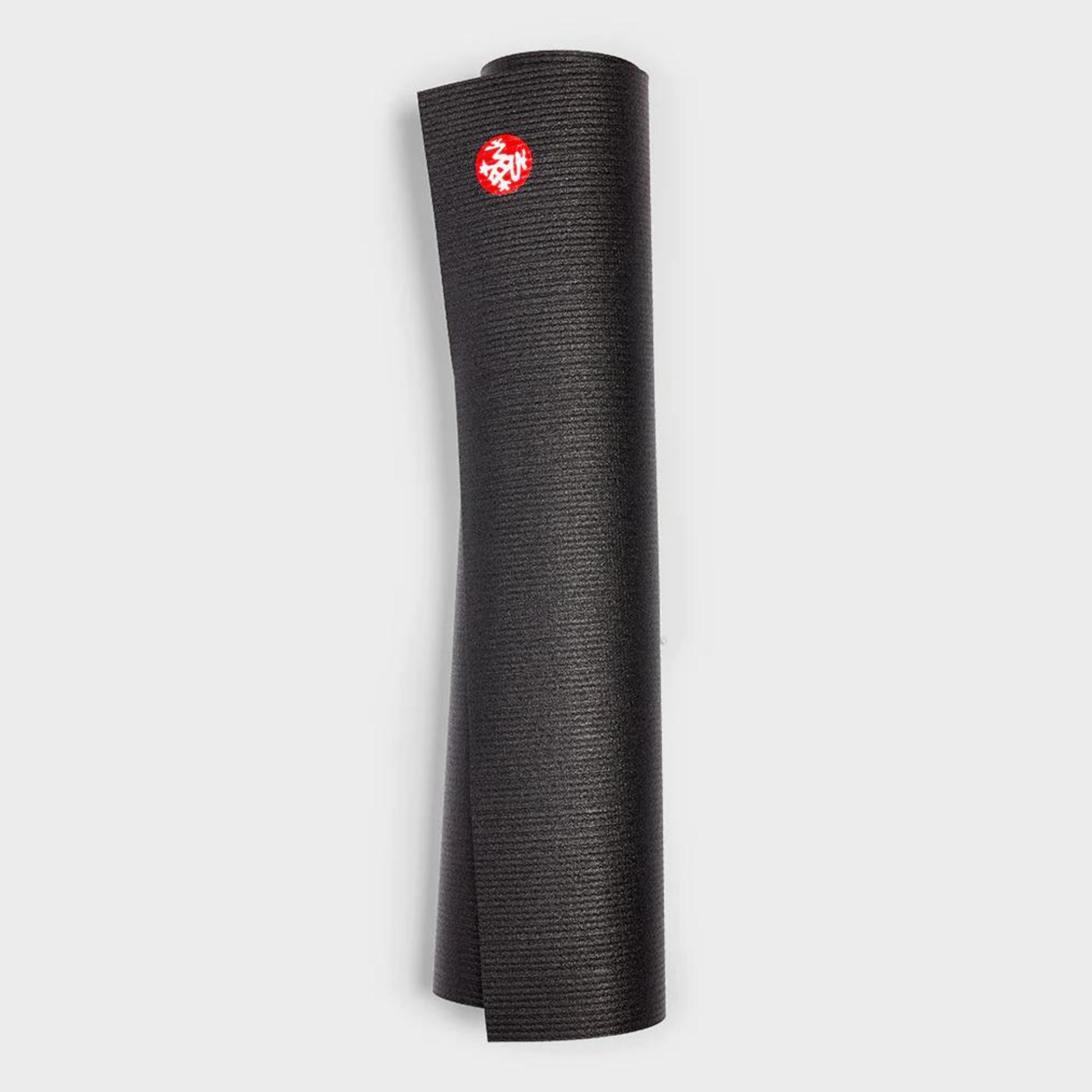 black manduka prolite yoga mat rolled up