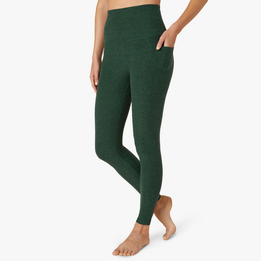 front of forest green high waist midi length legging with hand in pocket