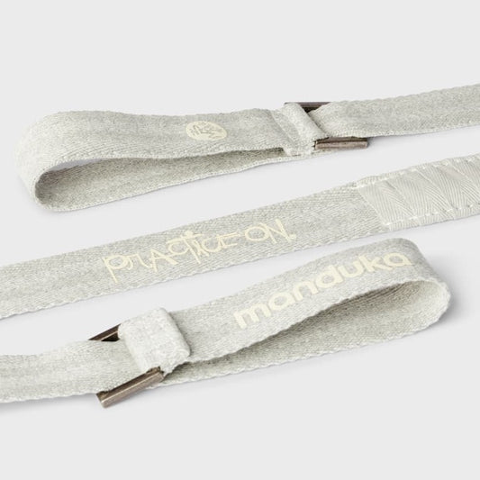 close up of cream colored yoga mat carrier strap 