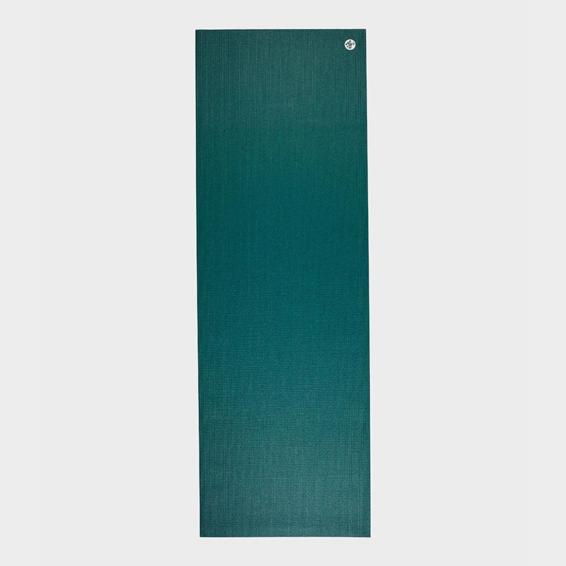 manduka prolite yoga mat in deep sea color rolled flat