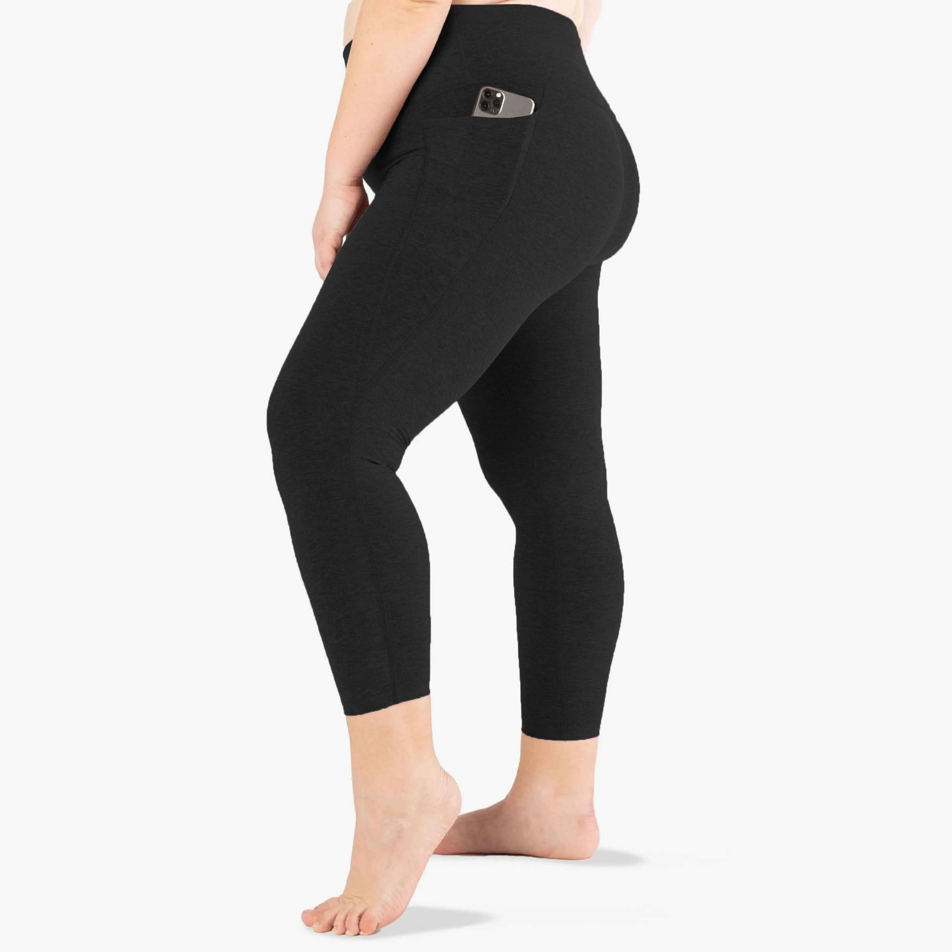 side of dark charcoal midi length legging with phone in pocket