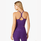 back of bright purple slim fit racerback cropped yoga tank top