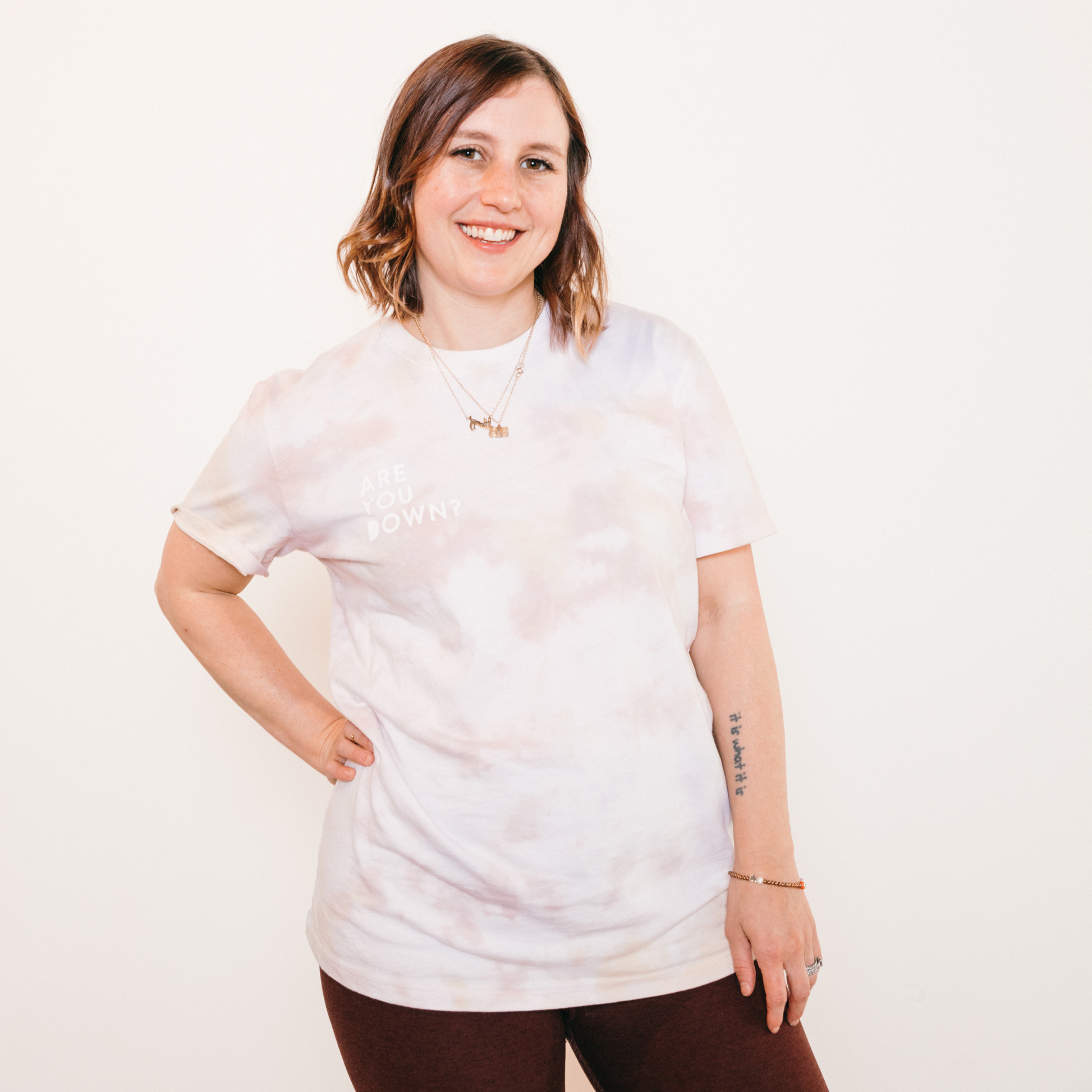 Tie-dye tee with the phrase are you down in upper righthand corner in white