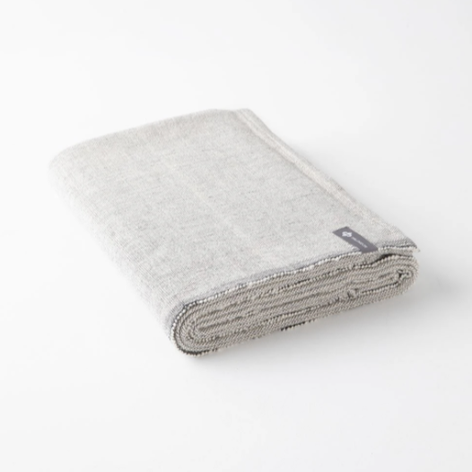 folded light grey blanket