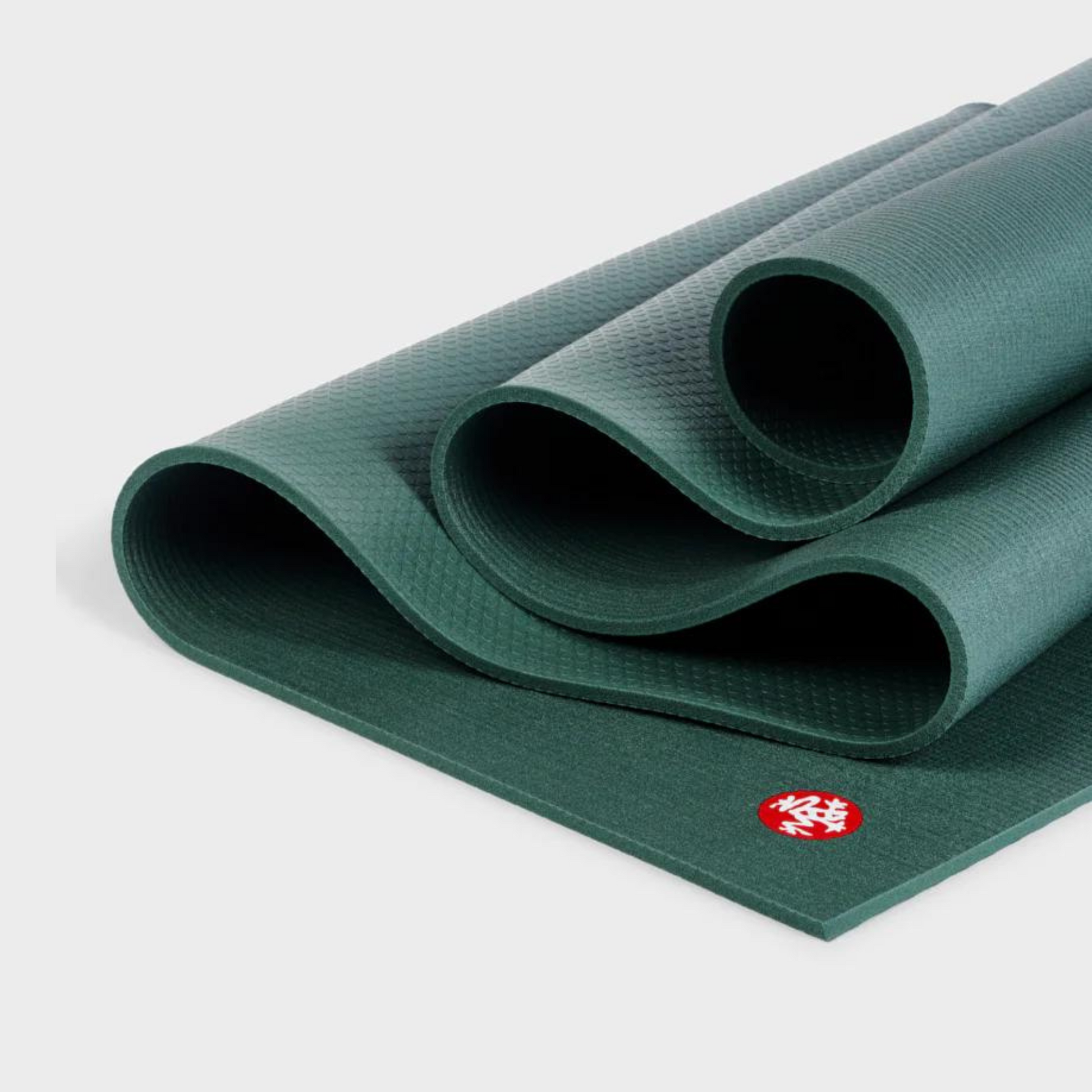 manduka pro yoga mat in black sage in folds