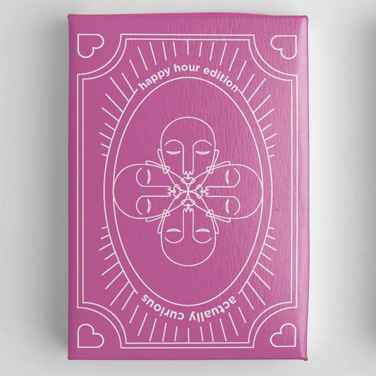 pink deck of cards with actually curious happy hour edition written on it