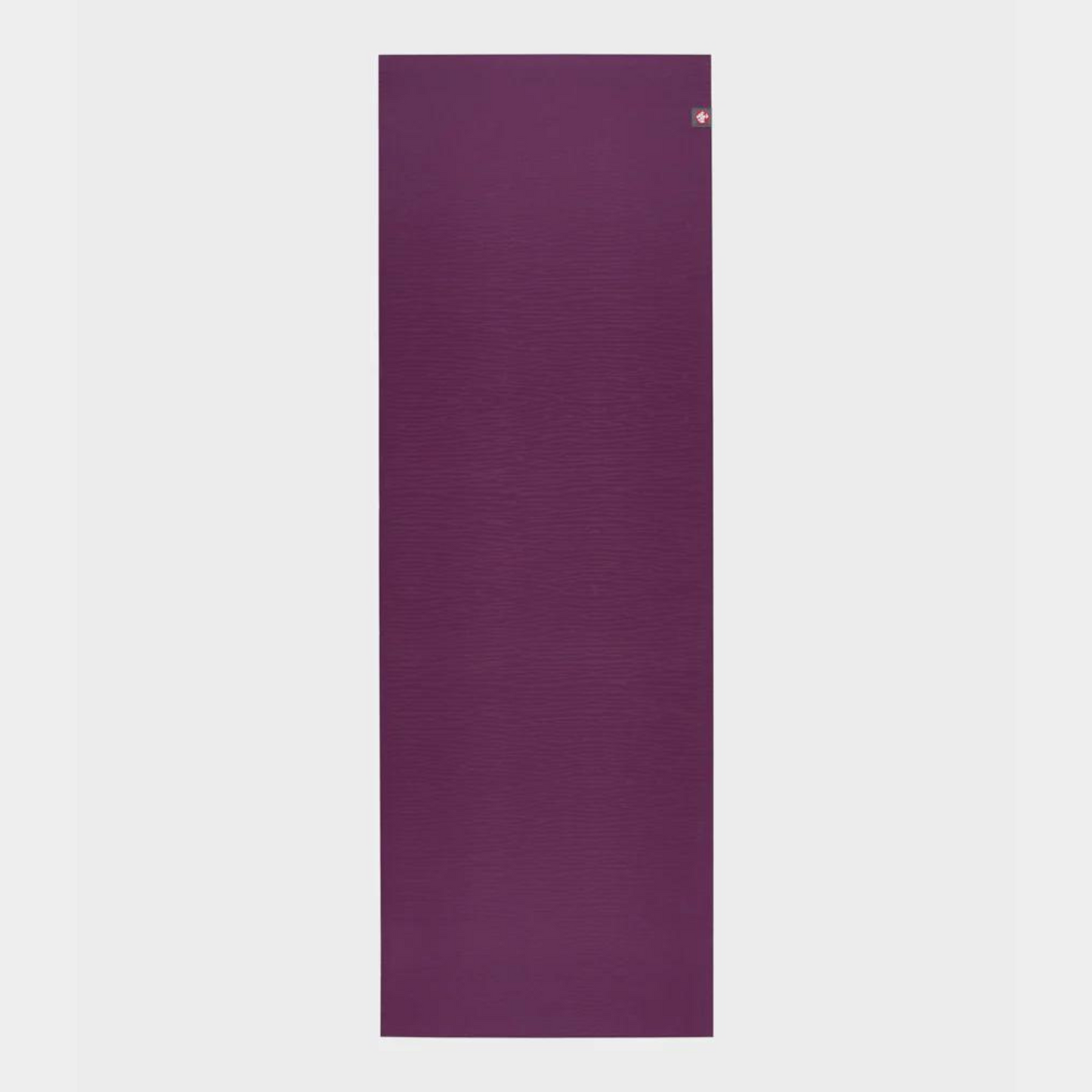 dark purple manduka eko lite yoga mat rolled flat