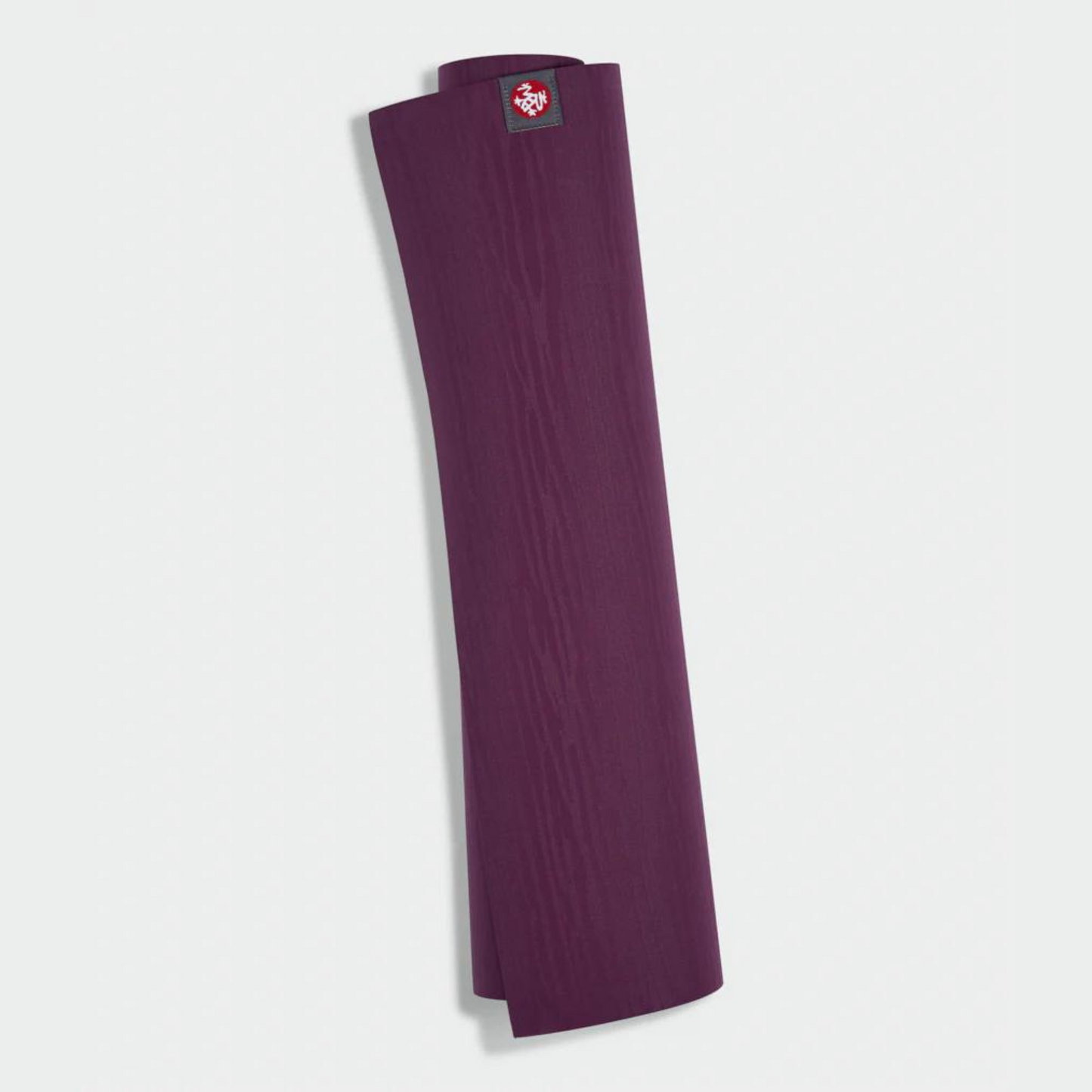 dark purple manduka eko lite yoga mat rolled up