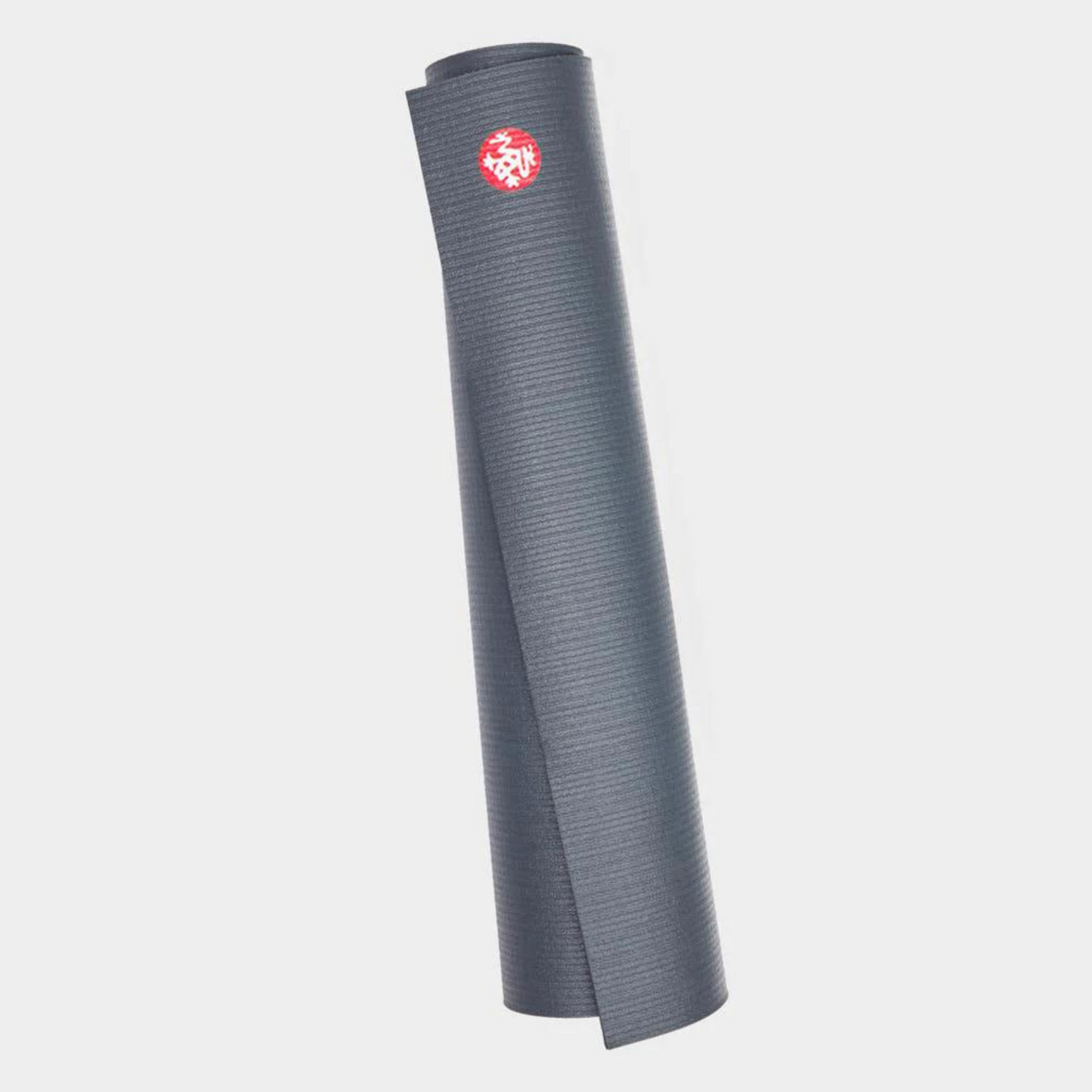 dark grey manduka prolite yoga mat rolled up